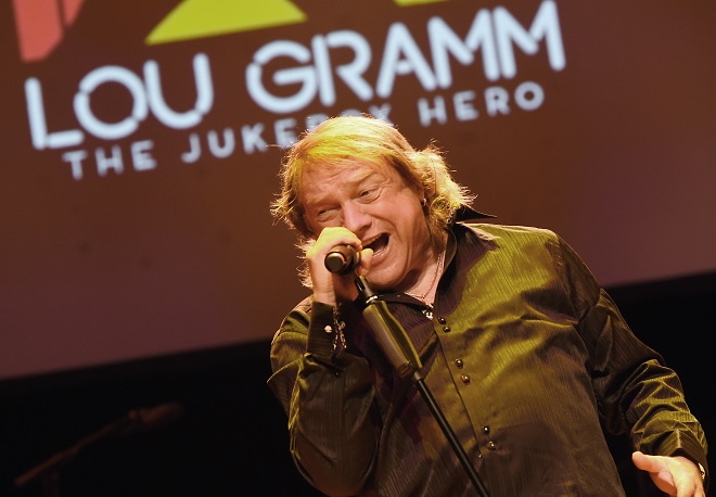 Lou Gramm singing on stage.